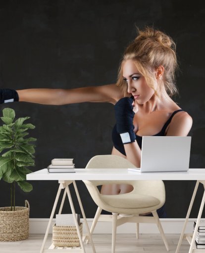 Sexy boxer woman making kick with boxing bandage mural