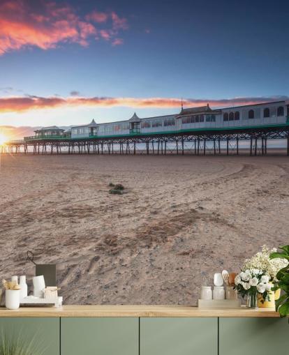 Fondo de pantalla de playa y muelle al atardecer