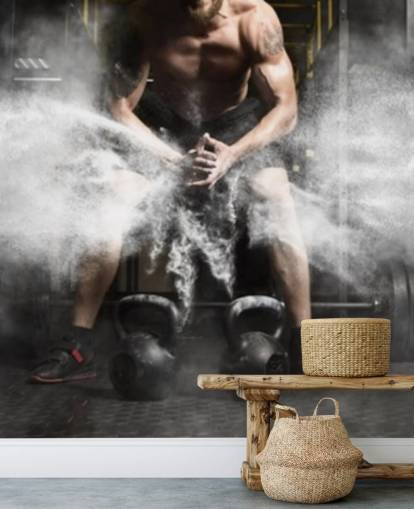 Muscular man workout with kettlebell at gym wallpaper