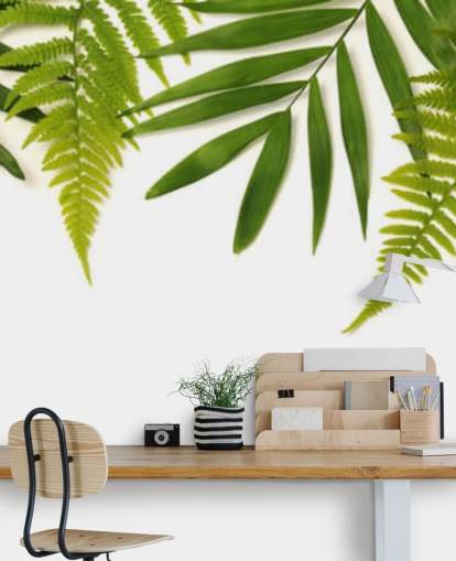 decorazione murale con foglie verdi tropicali su sfondo bianco