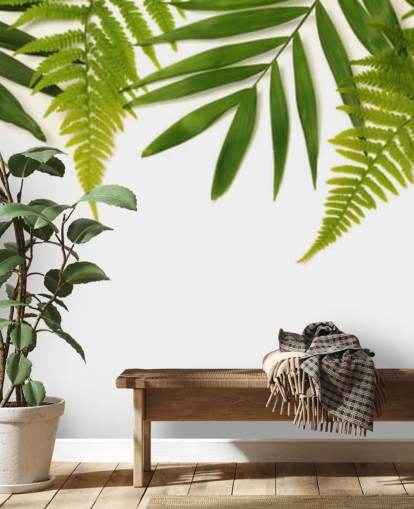 decorazione murale con foglie verdi tropicali su sfondo bianco