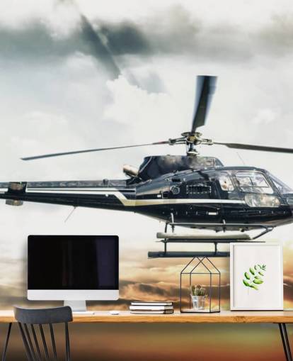 Helikopter vliegen bij zonsondergang behang