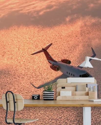 Papel pintado Avión sobre el océano al atardecer