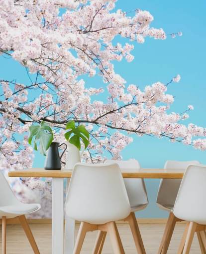 Mural Flor rosa contra un cielo azul brillante