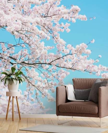 Pink Blossom tegen een felblauwe luchtmuurschildering