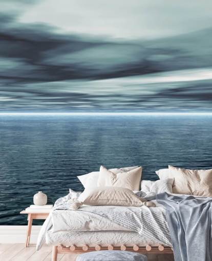 Papier Peint Ciel gris nuageux et océan calme Papier Peint Ciel gris nuageux et océan calme