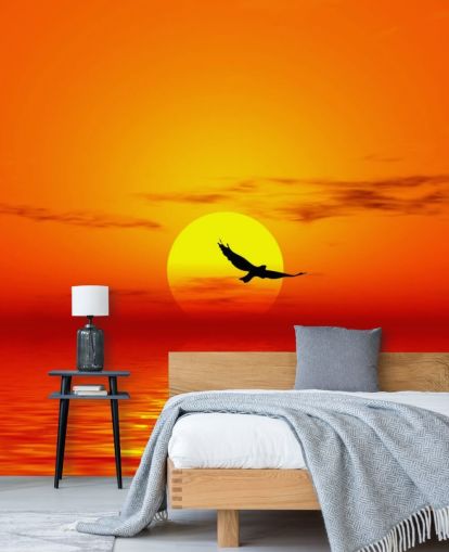 Bird Flying Over Ocean at Sunset Wall Mural