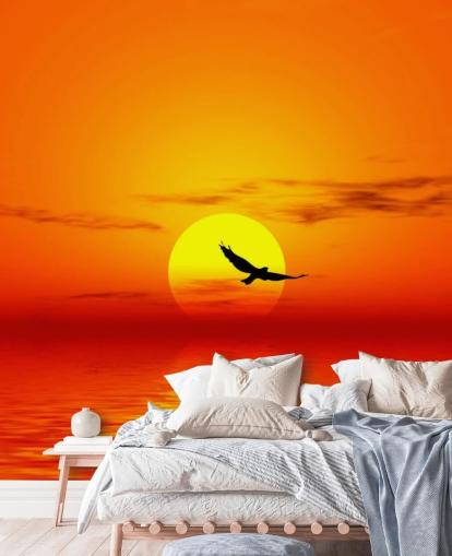 Bird Flying Over Ocean at Sunset Wall Mural
