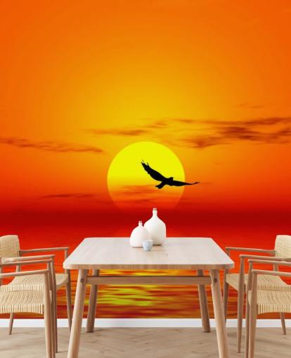 Bird Flying Over Ocean at Sunset Wall Mural
