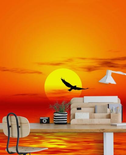 Bird Flying Over Ocean at Sunset Wall Mural