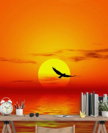 Bird Flying Over Ocean at Sunset Wall Mural