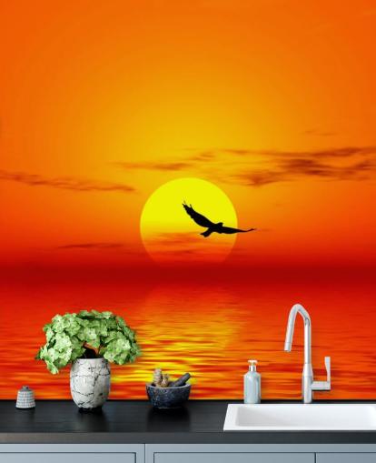 Bird Flying Over Ocean at Sunset Wall Mural