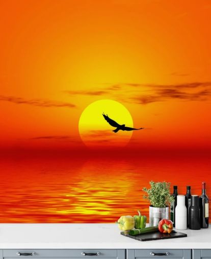 Bird Flying Over Ocean at Sunset Wall Mural