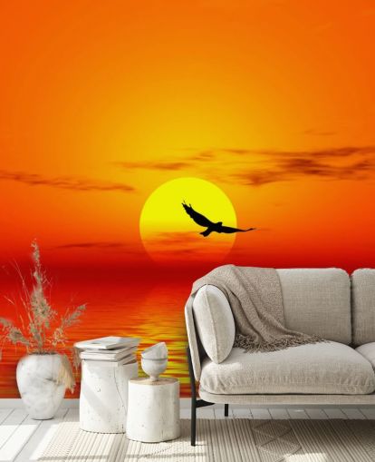 Fugl flyr over havet ved solnedgang veggmaleri