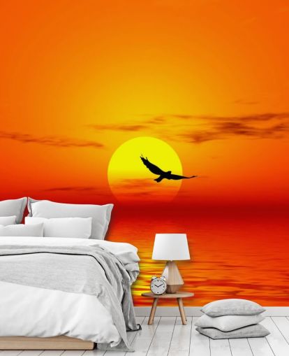Bird Flying Over Ocean at Sunset Wall Mural