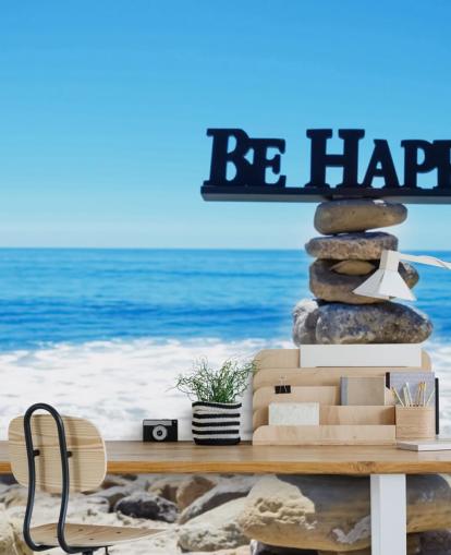 Sign Be Happy on balanced rocks