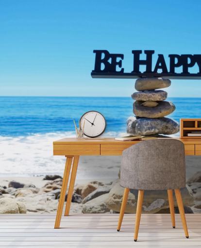 Sign Be Happy op gebalanceerde rotsen