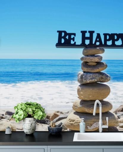 Sign Be Happy on balanced rocks