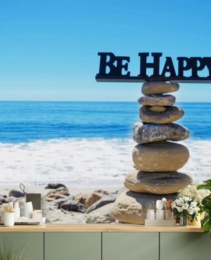 Signe Be Happy sur des rochers équilibrés