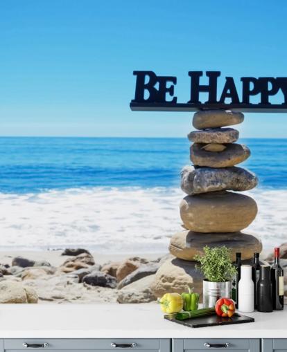 Sign Be Happy on balanced rocks