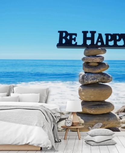 Sign Be Happy on balanced rocks