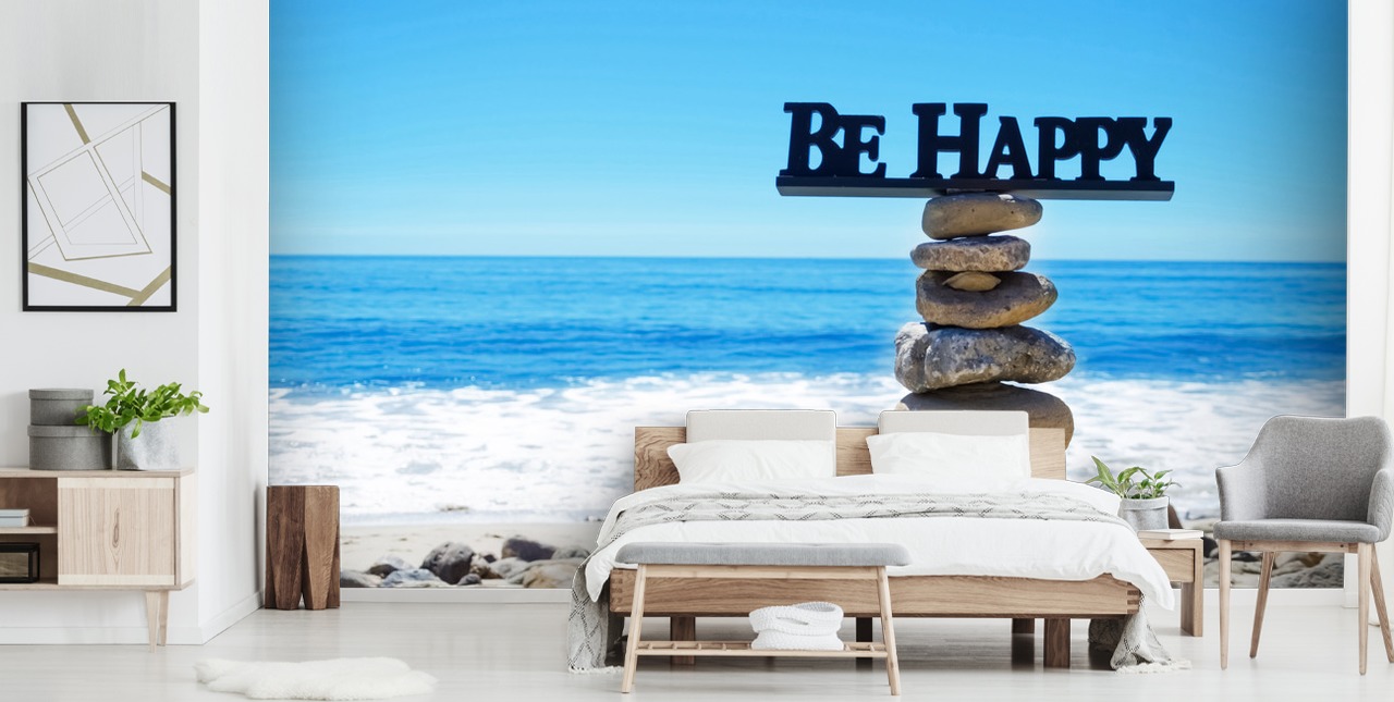 Signe Be Happy sur des rochers équilibrés
