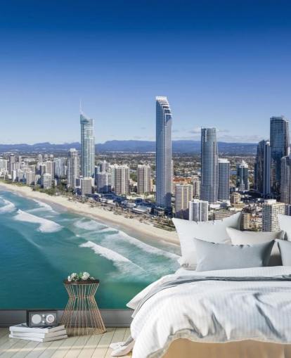 long stretch of beach next to city wallpaper