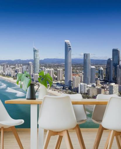 long stretch of beach next to city wallpaper