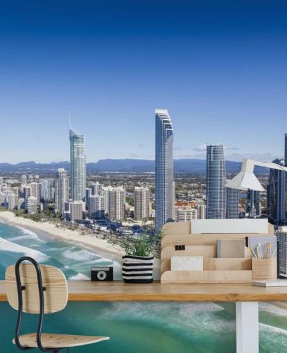 long stretch of beach next to city wallpaper