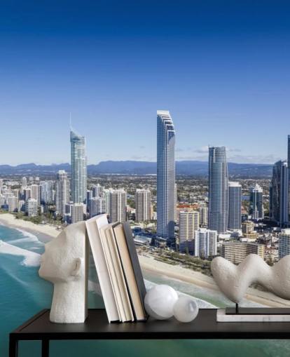 long stretch of beach next to city wallpaper