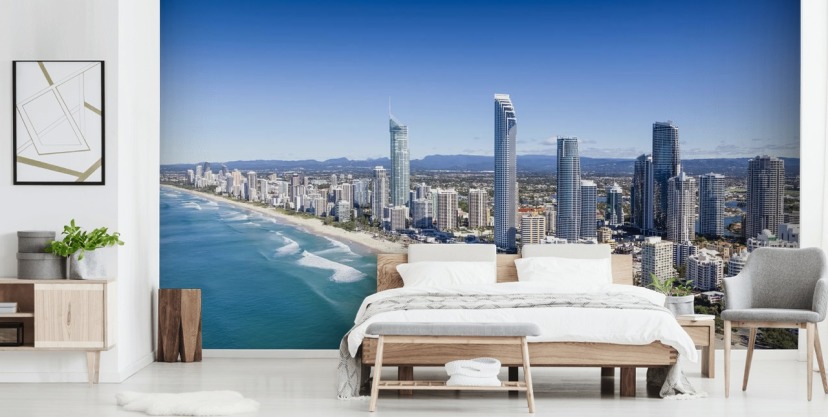 long stretch of beach next to city wallpaper