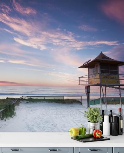 Badevakt hytte på stranden ved solnedgang veggmaleri