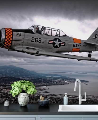 Vliegend Hellcat-vliegtuig boven de kust behang