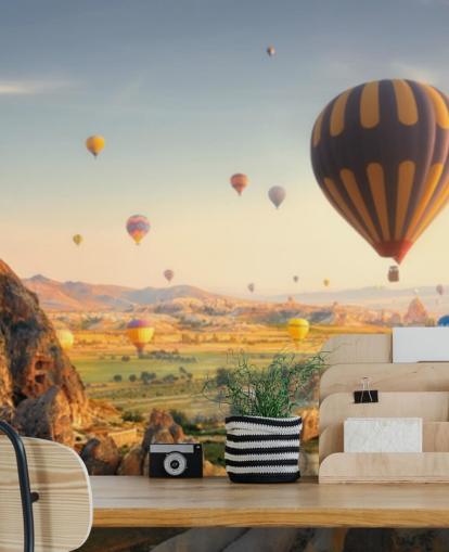 colourful hot air balloons in mountain landscape wallpaper