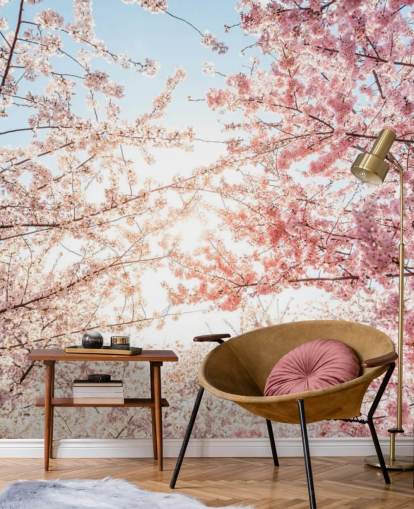 rami di fiori di ciliegio rosa su carta da parati blu cielo