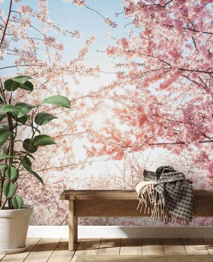 lyserøde kirsebærblomstgrene mod blå himmel tapet