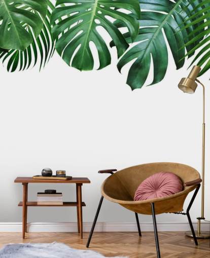 groen monstera en palmbladeren behang