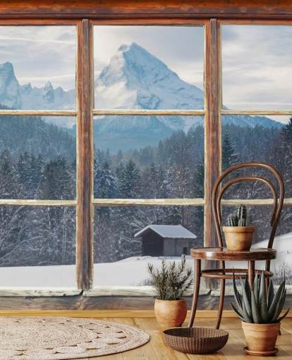 Wallpaper met uitzicht op het besneeuwde bergraam