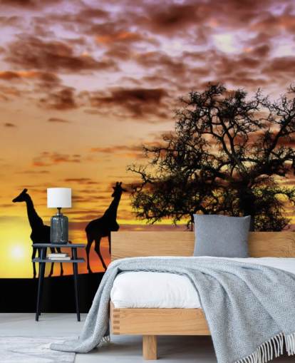 fond d'écran silhouettes de girafes et d'éléphants contre le coucher du soleil