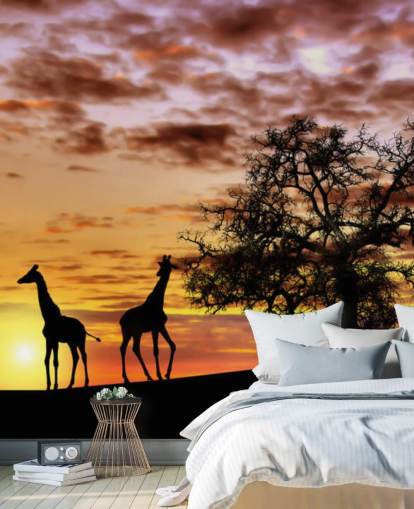 fond d'écran silhouettes de girafes et d'éléphants contre le coucher du soleil