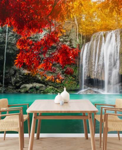 orange and yellow trees by waterfall wallpaper