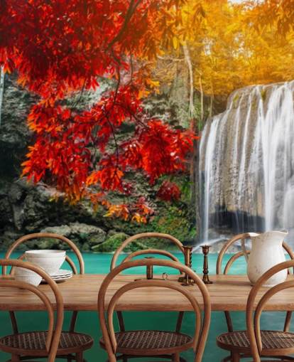 orange and yellow trees by waterfall wallpaper