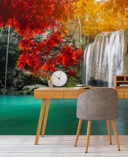 orange and yellow trees by waterfall wallpaper