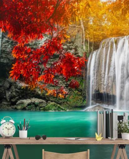 orange and yellow trees by waterfall wallpaper