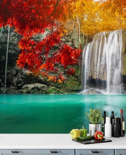 orange and yellow trees by waterfall wallpaper