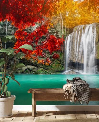 orange and yellow trees by waterfall wallpaper