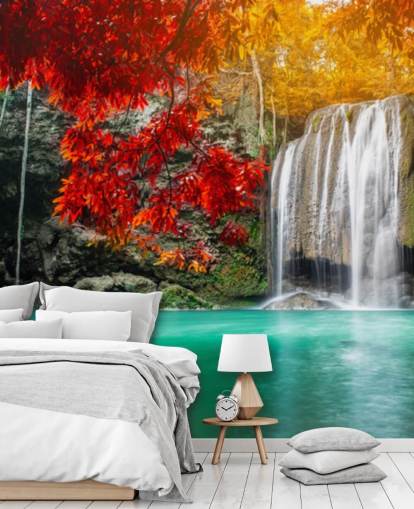 orange and yellow trees by waterfall wallpaper