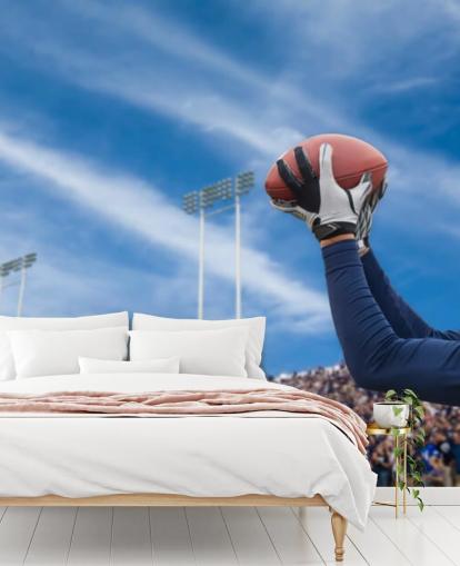 NFL Player Catching Ball with Crowd Backdrop Wallpaper