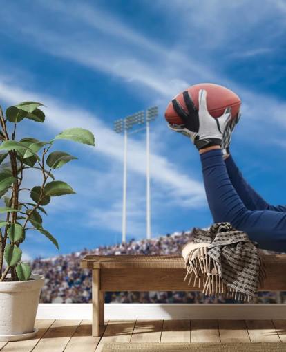 Jogador da NFL pegando bola com fundo de multidão papel de parede