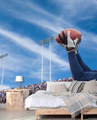 NFL Player Catching Ball med Crowd Bakteppe Bakgrunn